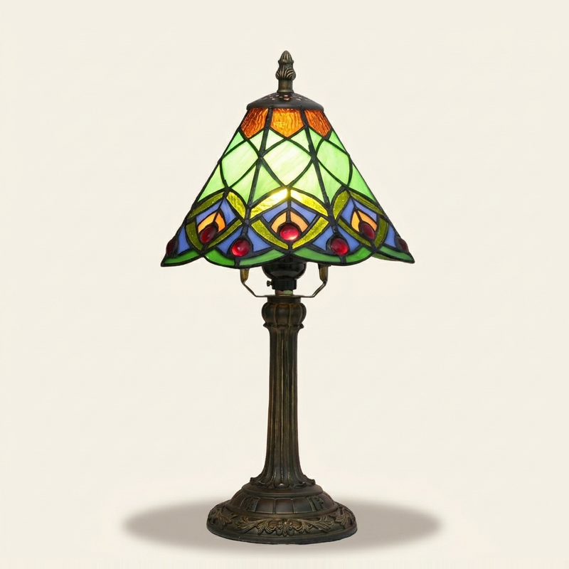 Verdania 8 Inch Tiffany-style stained glass table lamp, lit, on a plain ivory studio background