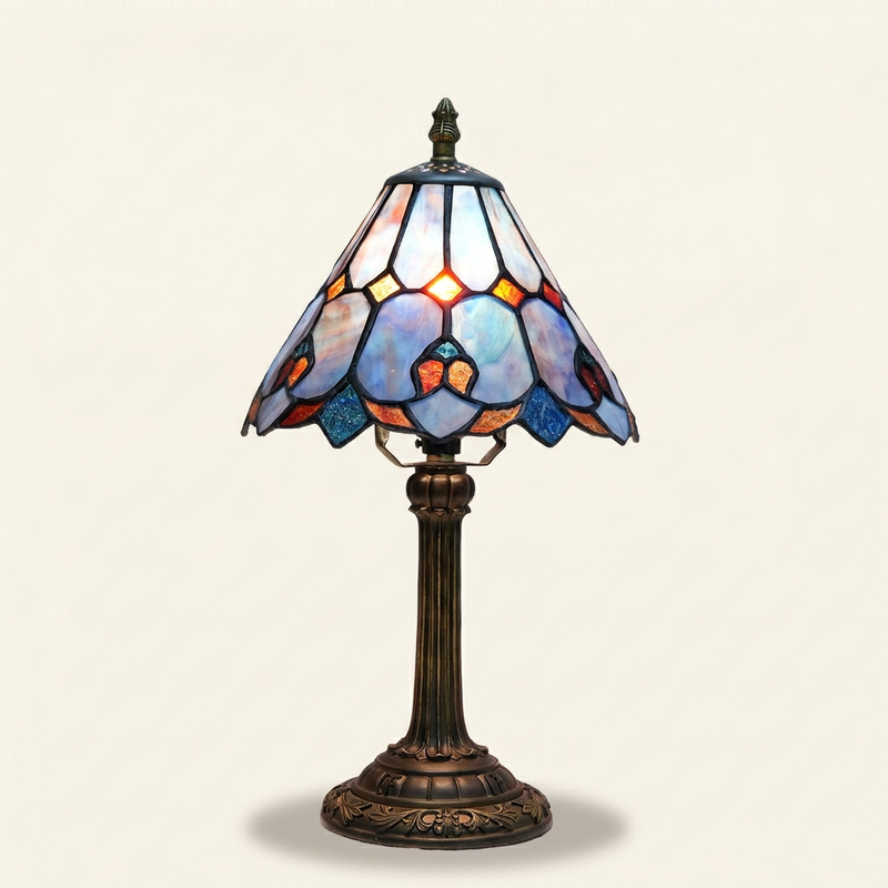 Violette 8 Inch Tiffany-style stained glass table lamp, lit, on a plain ivory studio background
