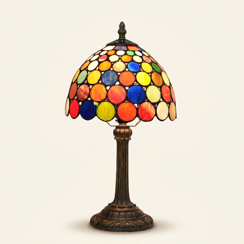 Pomelle 8 Inch Tiffany-style stained glass table lamp, Straight Pole base, lit, on a plain ivory studio background