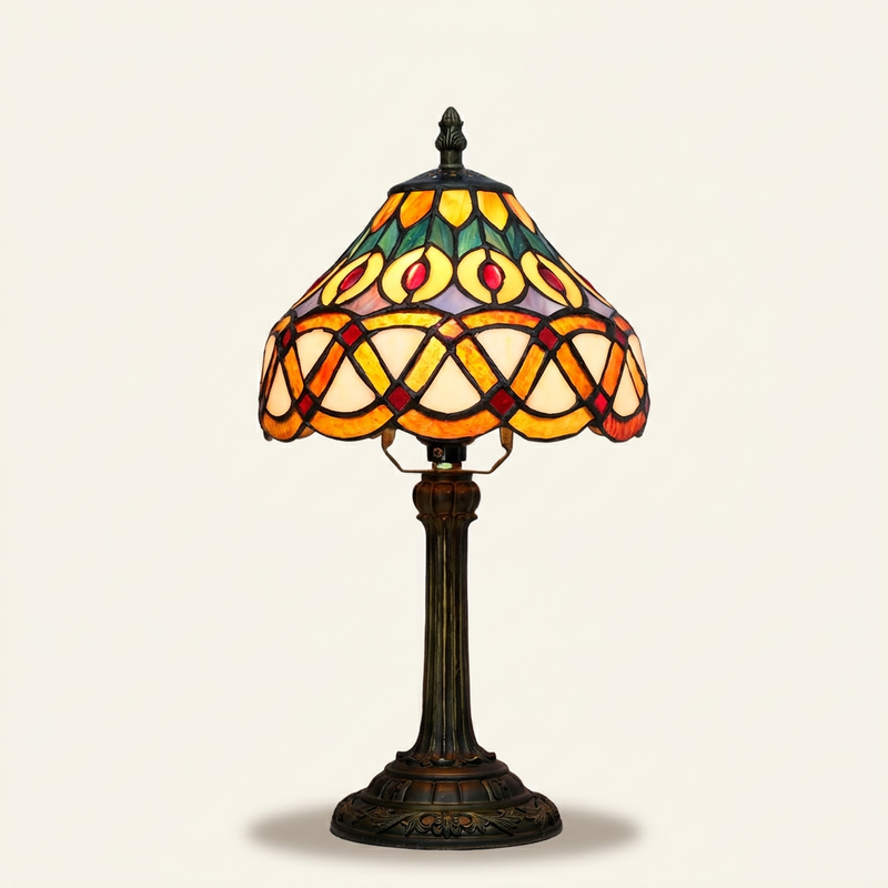 Aurelle 8 Inch Tiffany-style stained glass table lamp, lit, on a plain ivory studio background