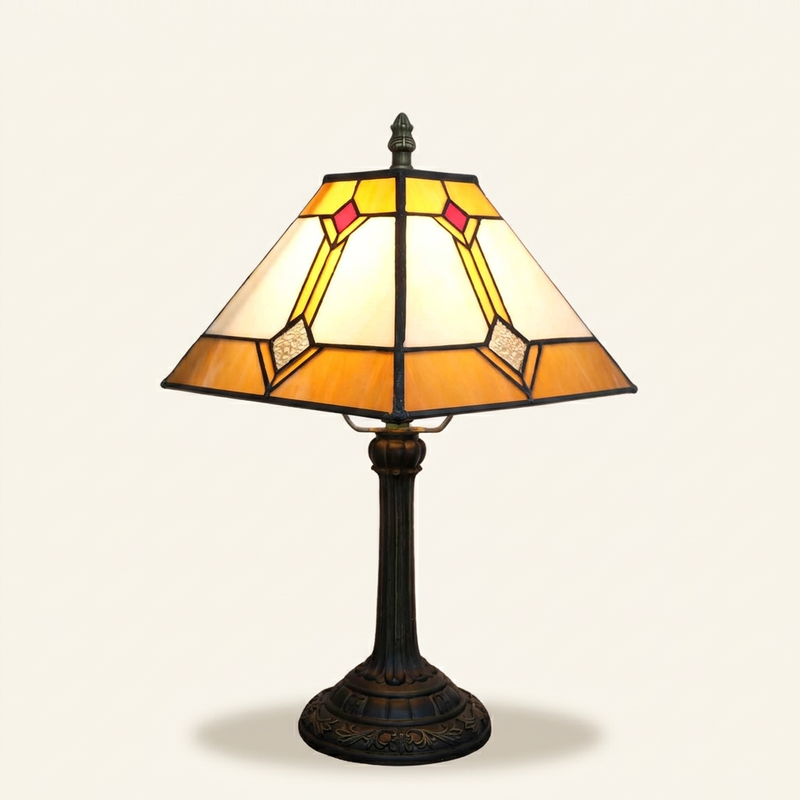 Aurvane 11 Inch Tiffany-style stained glass table lamp, lit, on a plain ivory studio background