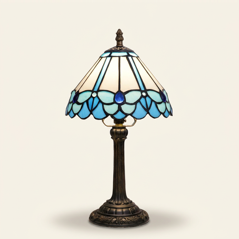 Papillon 8 Inch Tiffany-style stained glass table lamp, lit, on a plain ivory studio background