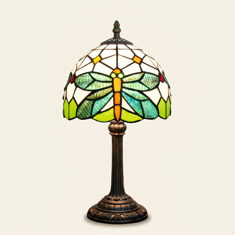 Mirelle 8 Inch Tiffany-style stained glass table lamp, lit, on a plain ivory studio background