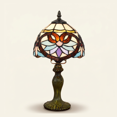 Ansley 8 Inch Tiffany-style stained glass table lamp, Curved Pole base, lit, on a plain ivory studio background