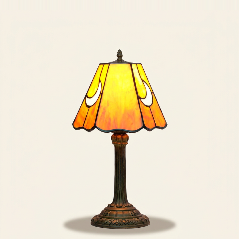 Aurelune 7 Inch Tiffany-style stained glass table lamp, lit, on a plain ivory studio background