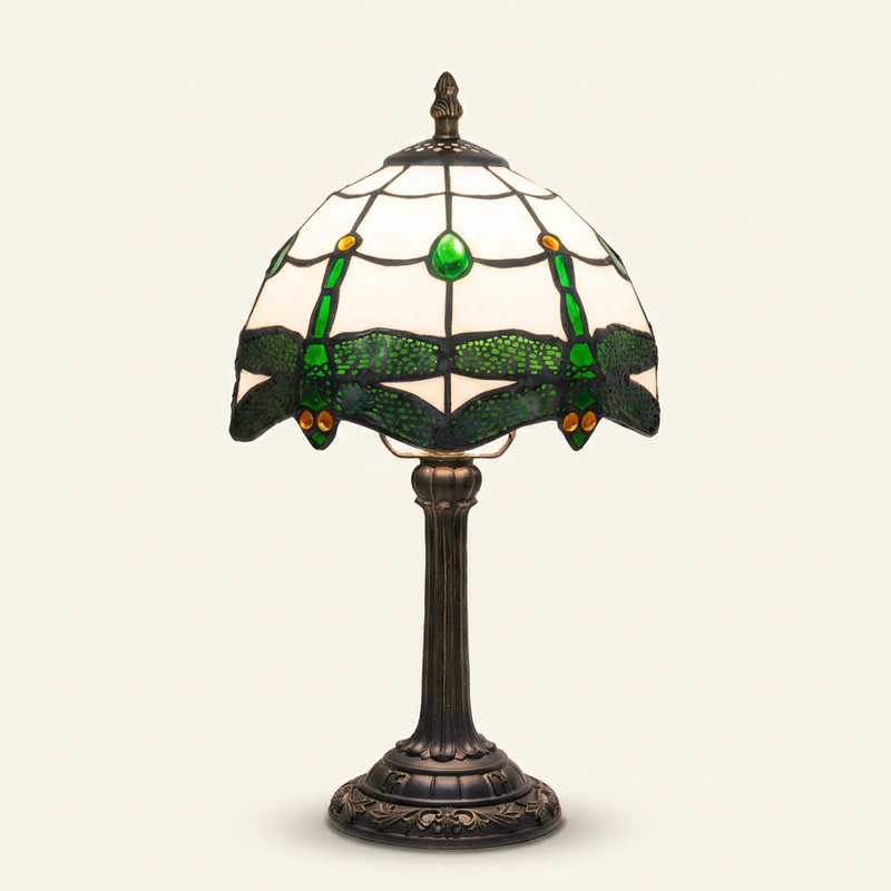 Thornvale 8 Inch Tiffany-style stained glass table lamp, lit, on a plain ivory studio background