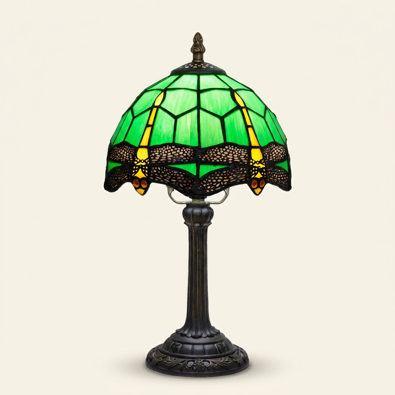 Sylvane 8 Inch Tiffany-style stained glass table lamp, lit, on a plain ivory studio background