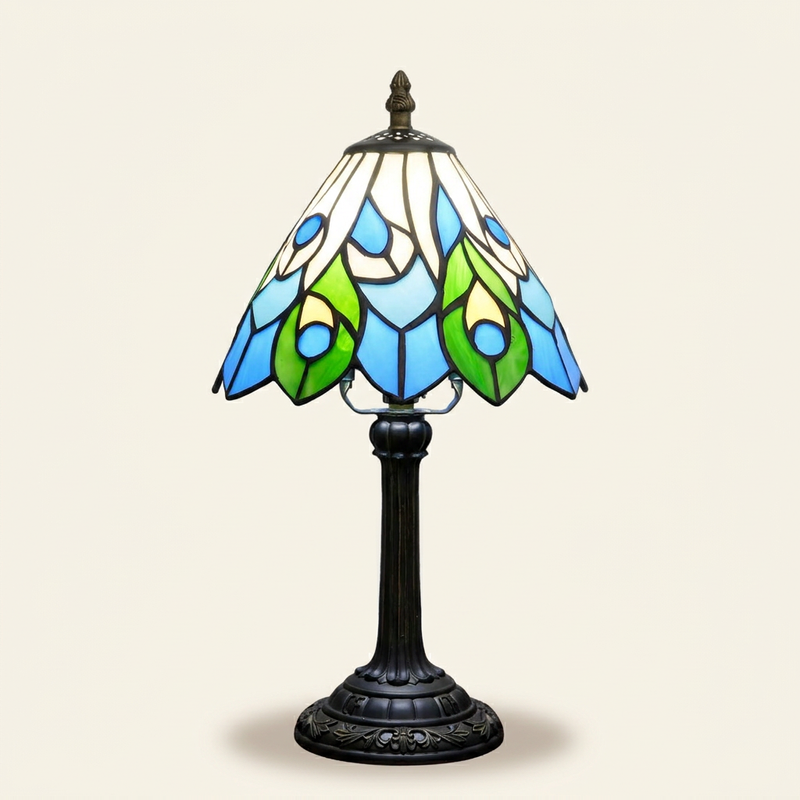 Junova 8 Inch Tiffany-style stained glass table lamp, lit, on a plain ivory studio background