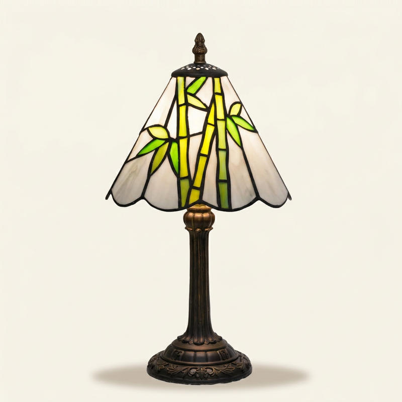 Kaida 8 Inch Tiffany-style stained glass table lamp, lit, on a plain ivory studio background