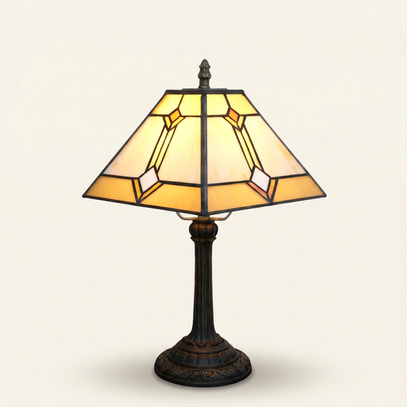 Solvane 11 Inch Tiffany-style stained glass table lamp, lit, on a plain ivory studio background