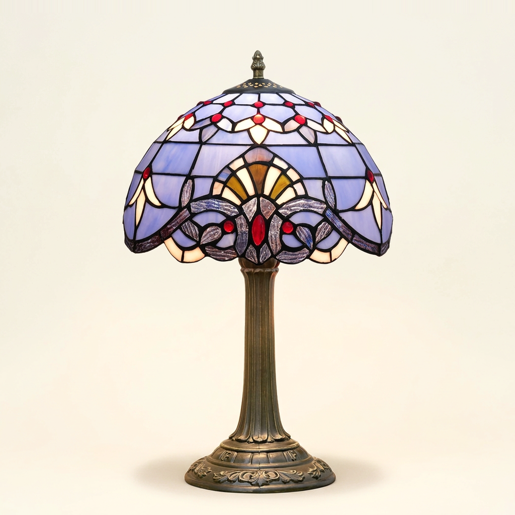 Bellamont 12 Inch Tiffany-style stained glass table lamp, Straight Pole base, lit, on a plain ivory studio background