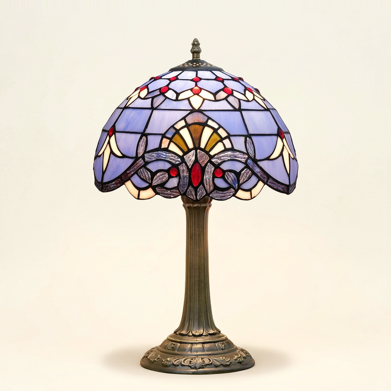 Bellamont 12 Inch Tiffany-style stained glass table lamp, Straight Pole base, lit, on a plain ivory studio background