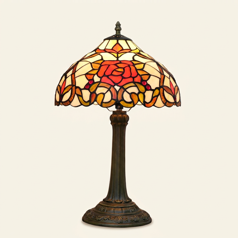 Rubelle 12 Inch Tiffany-style stained glass table lamp, lit, on a plain ivory studio background