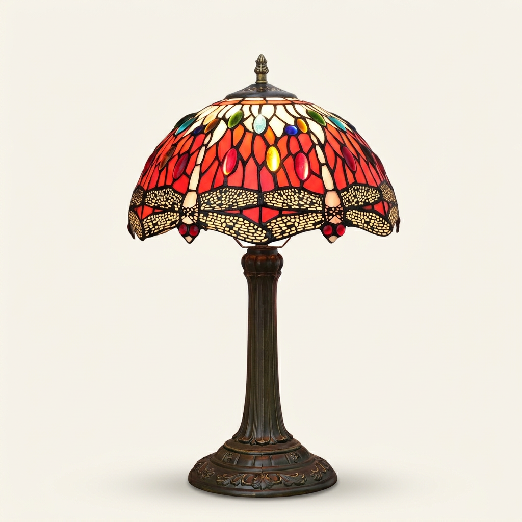 Rubellis 12 Inch Tiffany-style stained glass table lamp, lit, on a plain ivory studio background