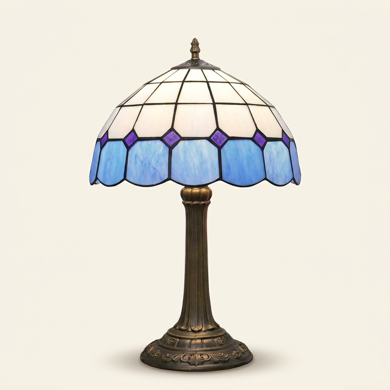 Ainsley 12 Inch Tiffany-style stained glass table lamp, Straight Pole base, lit, on a plain ivory studio background