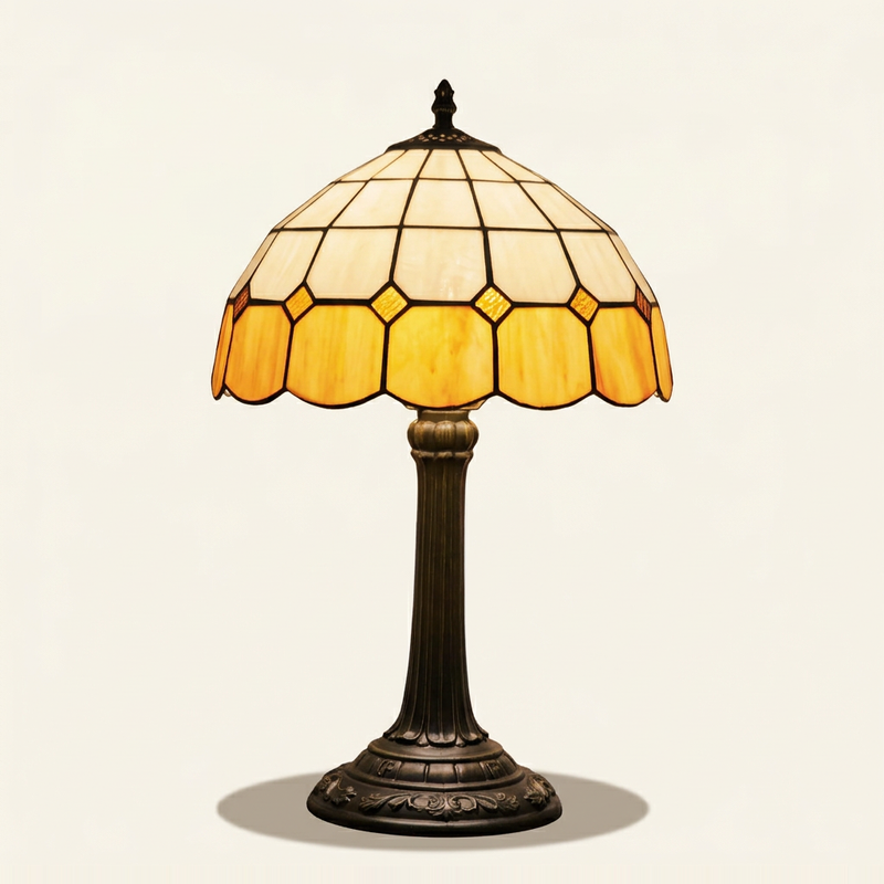 Wexford 12 Inch Tiffany-style stained glass table lamp, Straight Pole base, lit, on a plain ivory studio background