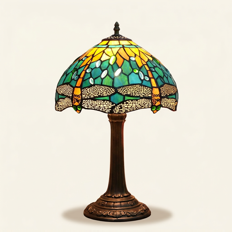 Verdis 12 Inch Tiffany-style stained glass table lamp, lit, on a plain ivory studio background