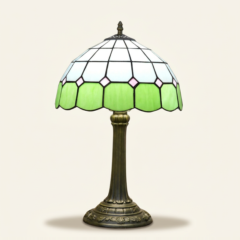 Braemar 12 Inch Tiffany-style stained glass table lamp, Straight Pole base, lit, on a plain ivory studio background