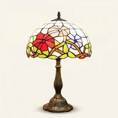 Aurorae 12 Inch Tiffany-style stained glass table lamp, Curved Pole base, lit, on a plain ivory studio background