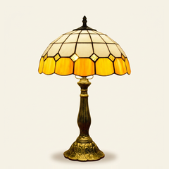 Wexford 12 Inch Tiffany-style stained glass table lamp, Curved Pole base, lit, on a plain ivory studio background
