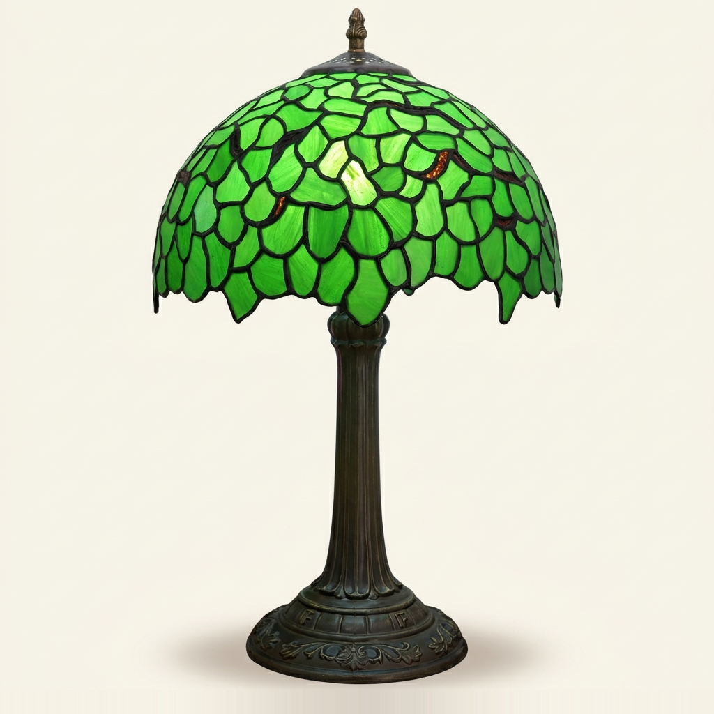 Verdelle 12 Inch Tiffany-style stained glass table lamp, lit, on a plain ivory studio background