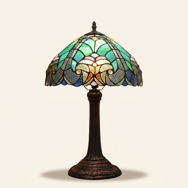 Verano 12 Inch Tiffany-style stained glass table lamp, lit, on a plain ivory studio background