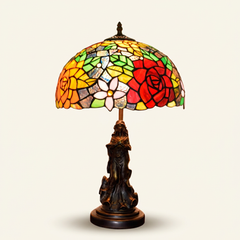 Rosalind 12 Inch Tiffany-style stained glass table lamp, Angelic Pole base, lit, on a plain ivory studio background