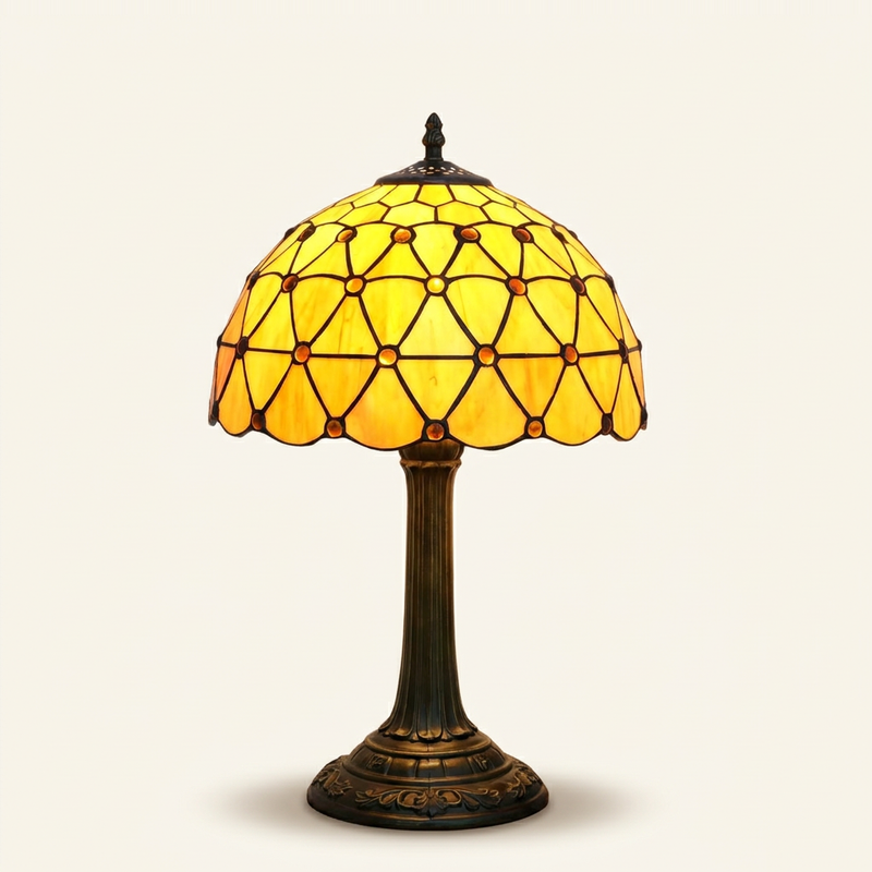 Amberly 12 Inch Tiffany-style stained glass table lamp, lit, on a plain ivory studio background
