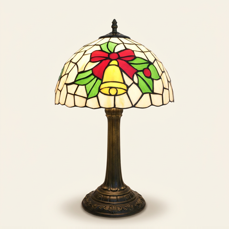 Carilla 12 Inch Tiffany-style stained glass table lamp, lit, on a plain ivory studio background