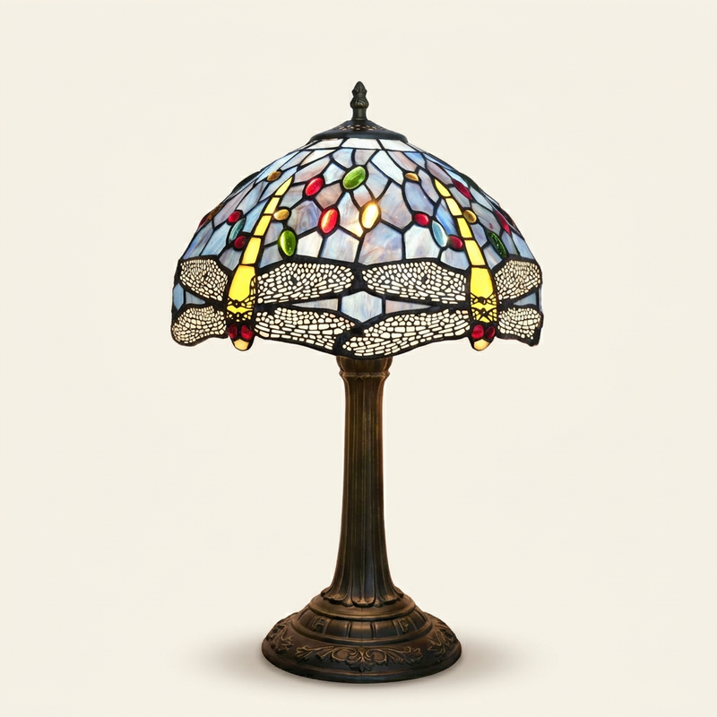 Libella 12 Inch Tiffany-style stained glass table lamp, lit, on a plain ivory studio background