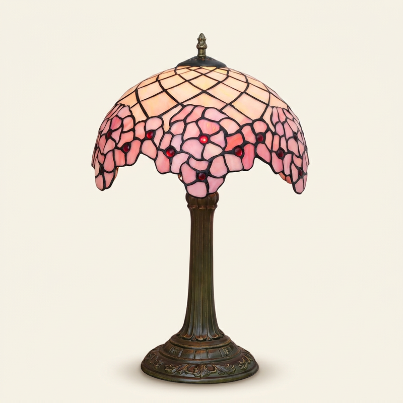 Hanami 12 Inch Tiffany-style stained glass table lamp, lit, on a plain ivory studio background