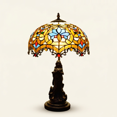 Seraphel 12 Inch Tiffany-style stained glass table lamp, Angelic Pole base, lit, on a plain ivory studio background