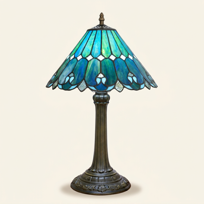Marivelle 12 Inch Tiffany-style stained glass table lamp, lit, on a plain ivory studio background