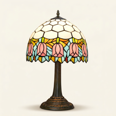 Tulippa 12 Inch Tiffany-style stained glass table lamp, Straight Pole base, lit, on a plain ivory studio background