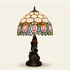 Tulippa 12 Inch Tiffany-style stained glass table lamp, Angelic Pole base, lit, on a plain ivory studio background