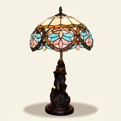 Amoria 12 Inch Tiffany-style stained glass table lamp, Angelic Pole base, lit, on a plain ivory studio background