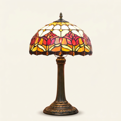 Tulira 12 Inch Tiffany-style stained glass table lamp, Straight Pole base, lit, on a plain ivory studio background