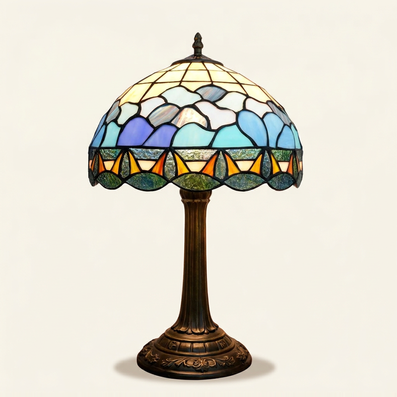 Oceane 12 Inch Tiffany-style stained glass table lamp, lit, on a plain ivory studio background