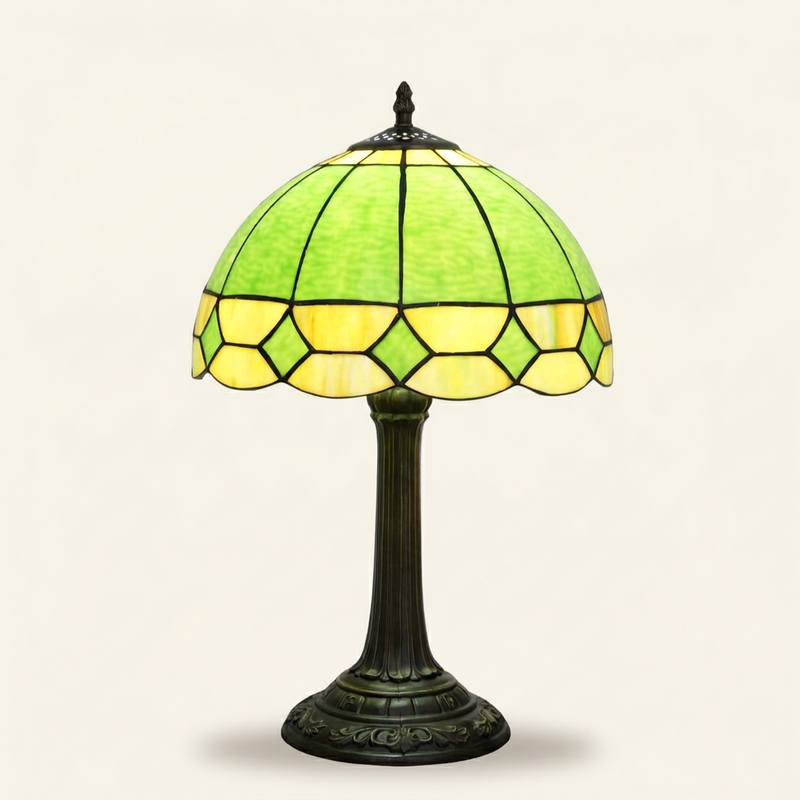 Curvelle 12 Inch Tiffany-style stained glass table lamp, lit, on a plain ivory studio background