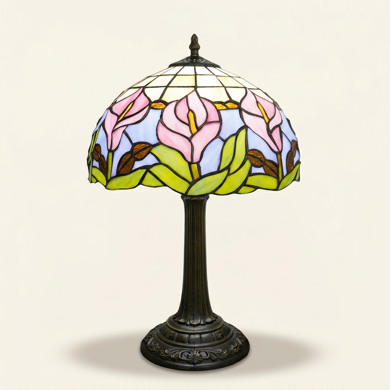 Callista 12 Inch Tiffany-style stained glass table lamp, lit, on a plain ivory studio background
