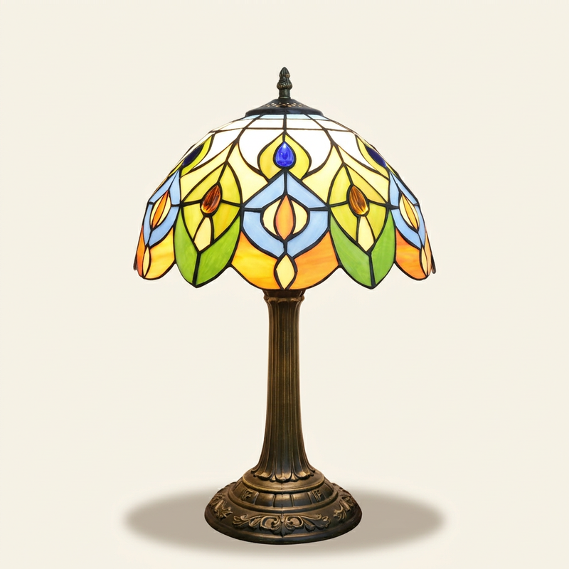 Coppelia 12 Inch Tiffany-style stained glass table lamp, lit, on a plain ivory studio background