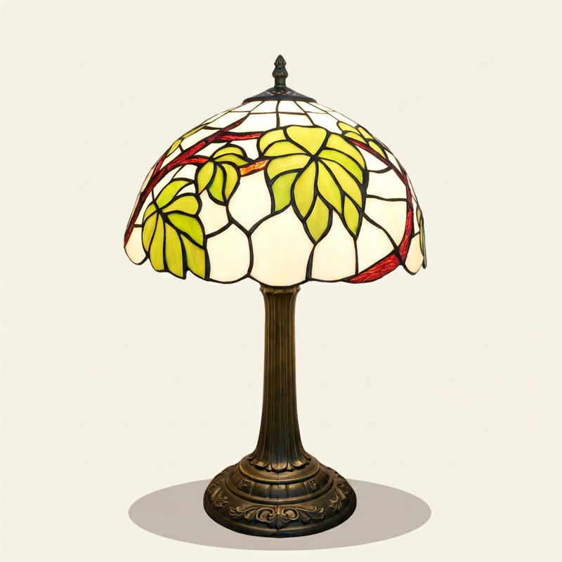 Vinovere 12 Inch Tiffany-style stained glass table lamp, lit, on a plain ivory studio background