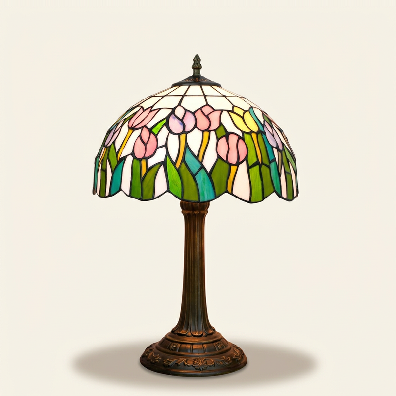 Liriane 12 Inch Tiffany-style stained glass table lamp, lit, on a plain ivory studio background