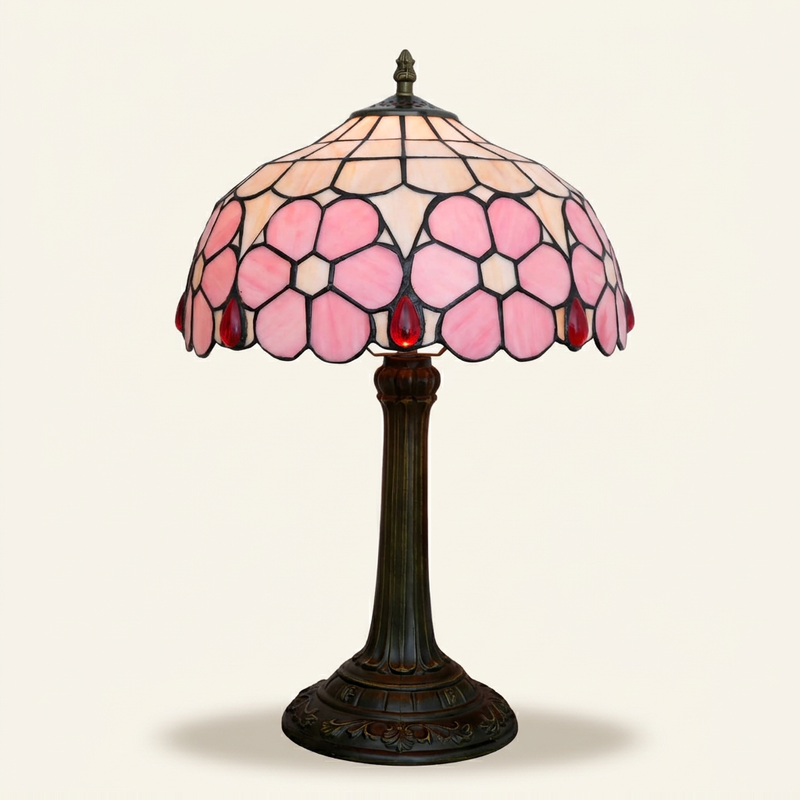 Kaiya 12 Inch Tiffany-style stained glass table lamp, lit, on a plain ivory studio background