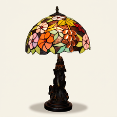 Vinelle 12 Inch Tiffany-style stained glass table lamp, Angelic Pole base, lit, on a plain ivory studio background