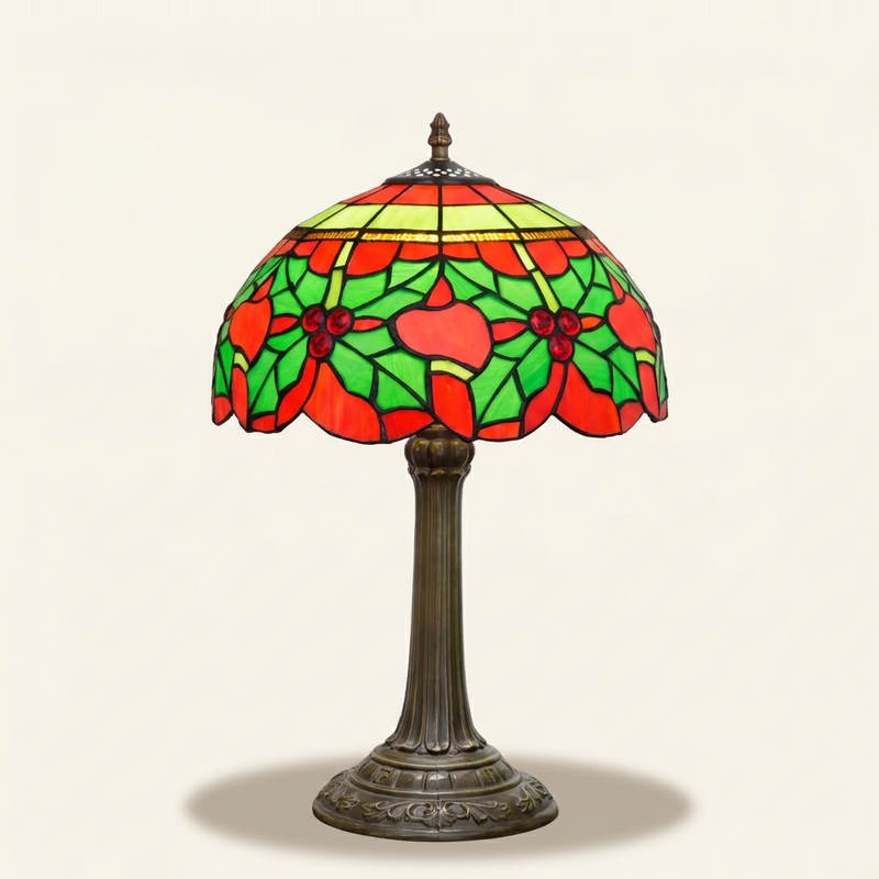 Yulette 12 Inch Tiffany-style stained glass table lamp, lit, on a plain ivory studio background