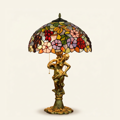 Muscadelle 16 Inch Tiffany-style stained glass table lamp, Angelic Pole base, lit, on a plain ivory studio background