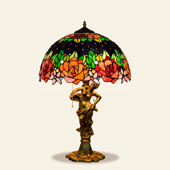 Corvina 16 Inch Tiffany-style stained glass table lamp, Angelic Pole base, lit, on a plain ivory studio background