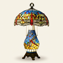 Caelith 16 Inch Tiffany-style stained glass table lamp, Stained Glass Pole base, lit, on a plain ivory studio background