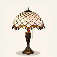 Cassiel 16 Inch Tiffany-style stained glass table lamp, Rose Pole base, lit, on a plain ivory studio background